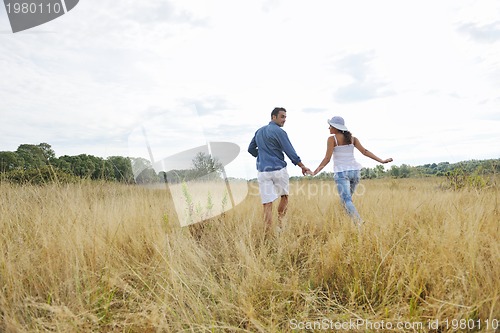 Image of happy young couple have romantic time outdoor