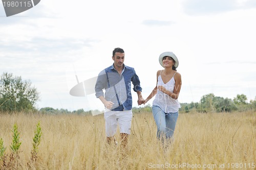 Image of happy young couple have romantic time outdoor