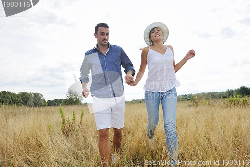 Image of happy young couple have romantic time outdoor