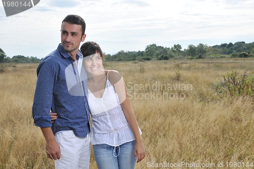 Image of happy young couple have romantic time outdoor