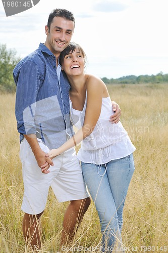 Image of happy young couple have romantic time outdoor