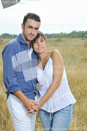 Image of happy young couple have romantic time outdoor