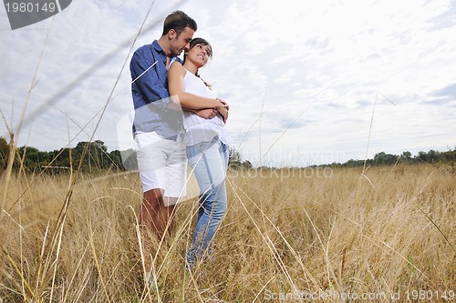 Image of happy young couple have romantic time outdoor