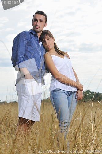 Image of happy young couple have romantic time outdoor