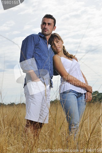 Image of happy young couple have romantic time outdoor