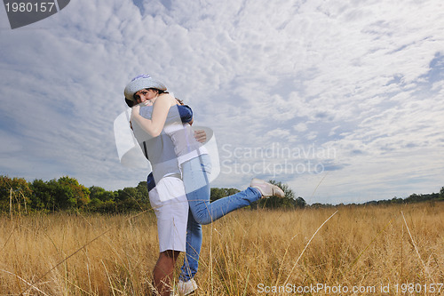 Image of happy young couple have romantic time outdoor
