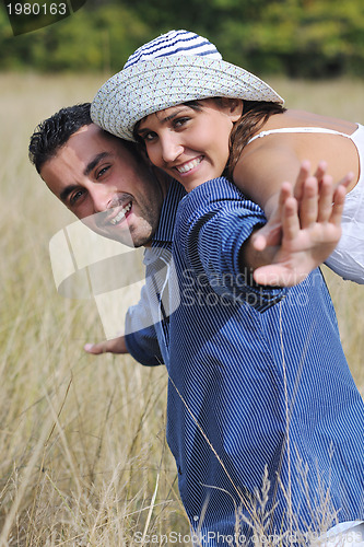 Image of happy young couple have romantic time outdoor