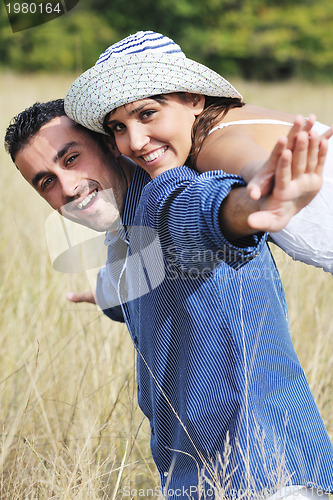 Image of happy young couple have romantic time outdoor