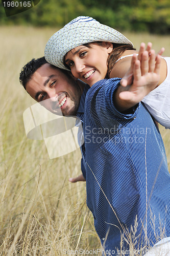 Image of happy young couple have romantic time outdoor