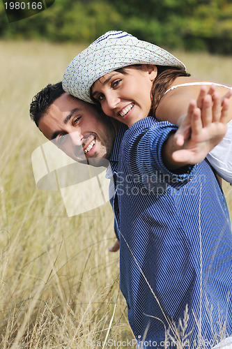 Image of happy young couple have romantic time outdoor