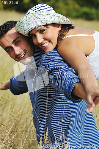 Image of happy young couple have romantic time outdoor