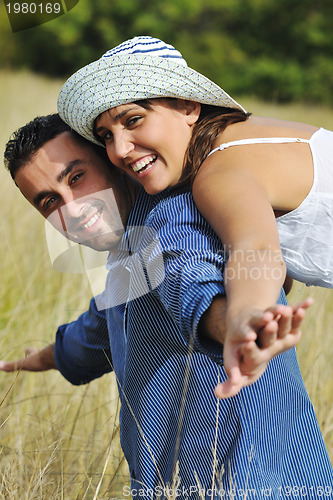 Image of happy young couple have romantic time outdoor