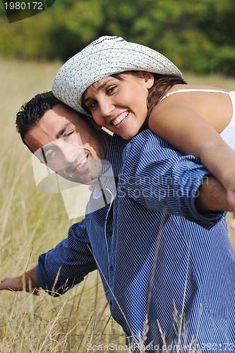 Image of happy young couple have romantic time outdoor