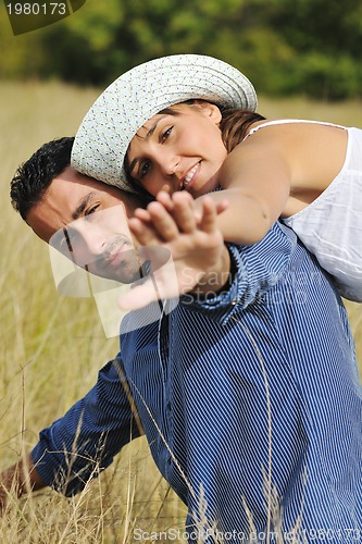 Image of happy young couple have romantic time outdoor