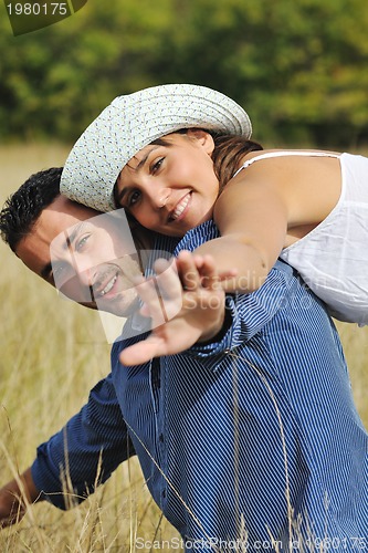 Image of happy young couple have romantic time outdoor