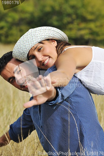 Image of happy young couple have romantic time outdoor