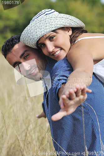 Image of happy young couple have romantic time outdoor