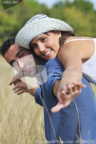 Image of happy young couple have romantic time outdoor