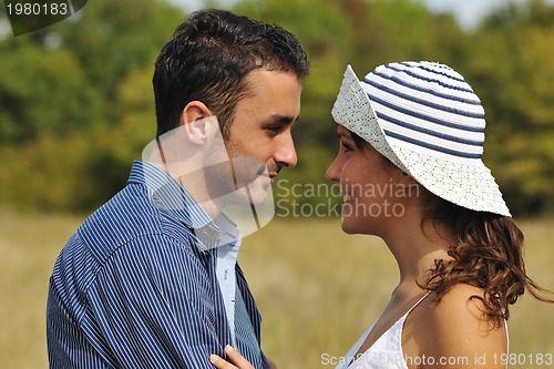 Image of happy young couple have romantic time outdoor