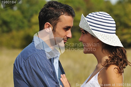Image of happy young couple have romantic time outdoor