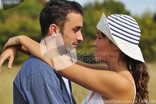 Image of happy young couple have romantic time outdoor