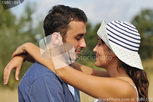 Image of happy young couple have romantic time outdoor