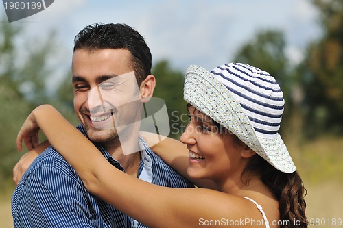 Image of happy young couple have romantic time outdoor