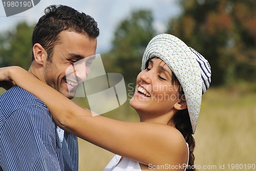 Image of happy young couple have romantic time outdoor