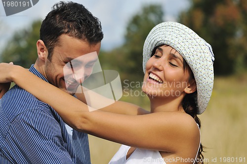 Image of happy young couple have romantic time outdoor