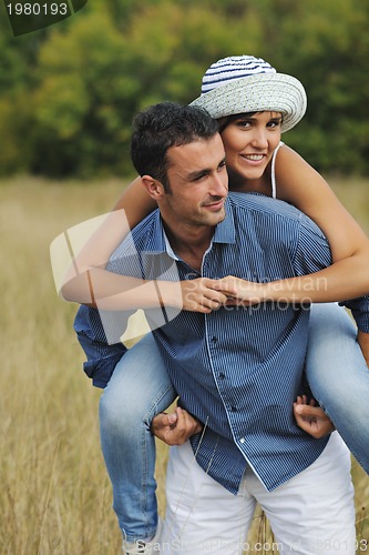 Image of happy young couple have romantic time outdoor