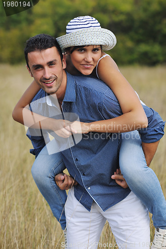 Image of happy young couple have romantic time outdoor
