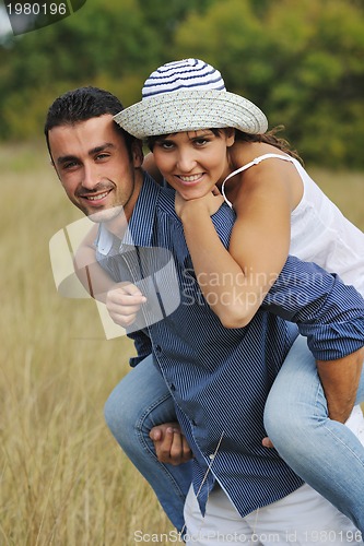 Image of happy young couple have romantic time outdoor