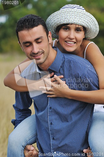 Image of happy young couple have romantic time outdoor