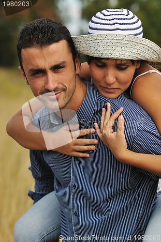 Image of happy young couple have romantic time outdoor