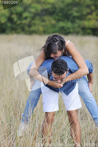 Image of happy young couple have romantic time outdoor