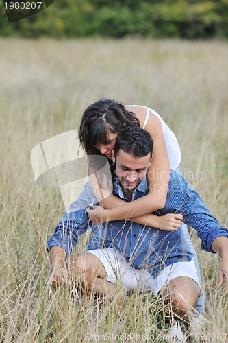 Image of happy young couple have romantic time outdoor