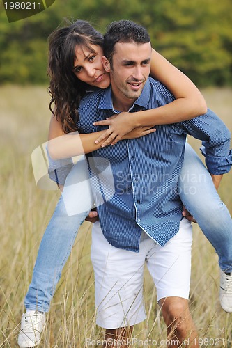 Image of happy young couple have romantic time outdoor