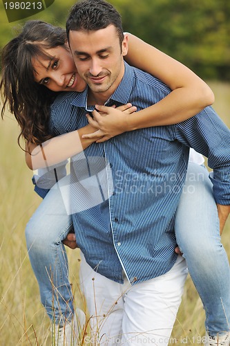 Image of happy young couple have romantic time outdoor