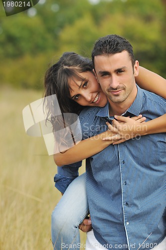 Image of happy young couple have romantic time outdoor