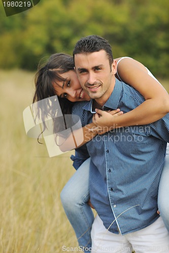 Image of happy young couple have romantic time outdoor