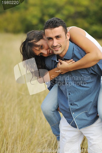 Image of happy young couple have romantic time outdoor