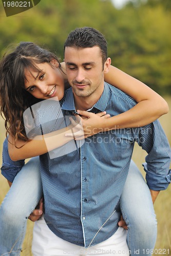 Image of happy young couple have romantic time outdoor