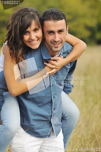 Image of happy young couple have romantic time outdoor