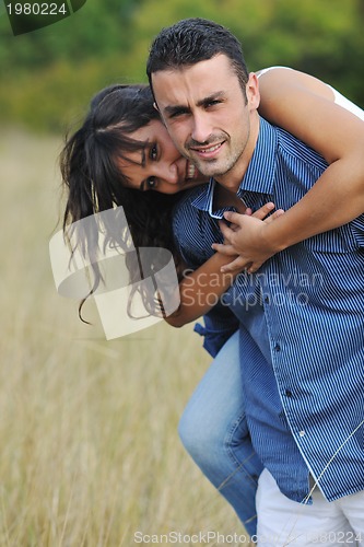 Image of happy young couple have romantic time outdoor