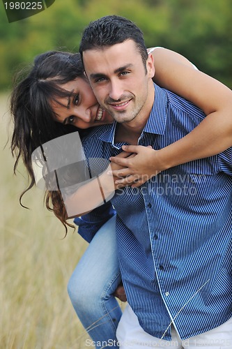 Image of happy young couple have romantic time outdoor