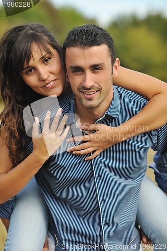 Image of happy young couple have romantic time outdoor