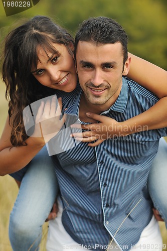 Image of happy young couple have romantic time outdoor