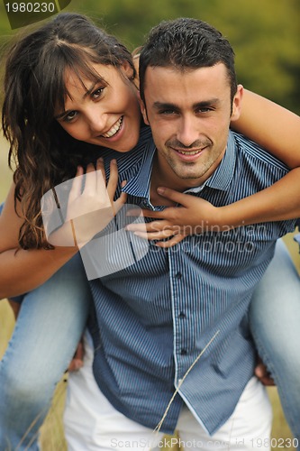 Image of happy young couple have romantic time outdoor