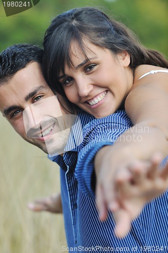 Image of happy young couple have romantic time outdoor