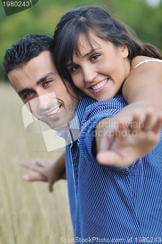 Image of happy young couple have romantic time outdoor